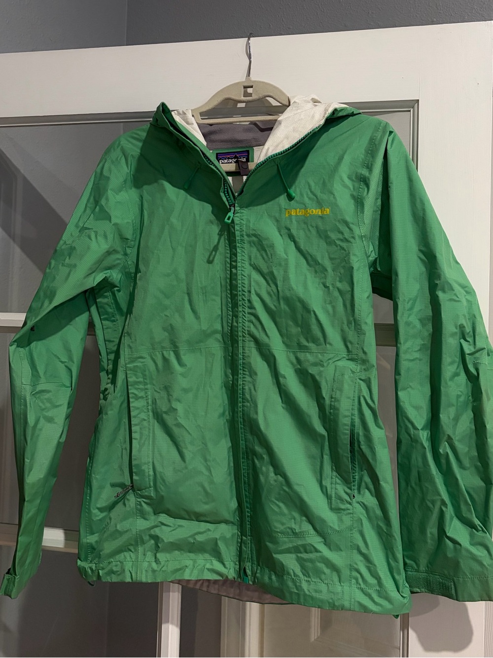 Patagonia Women’s Torentshell Green Hooded Raincoat with Yellow Logo
